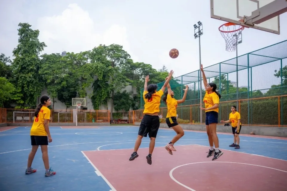 Students playing basketball at The Shri Ram School Aravali campus