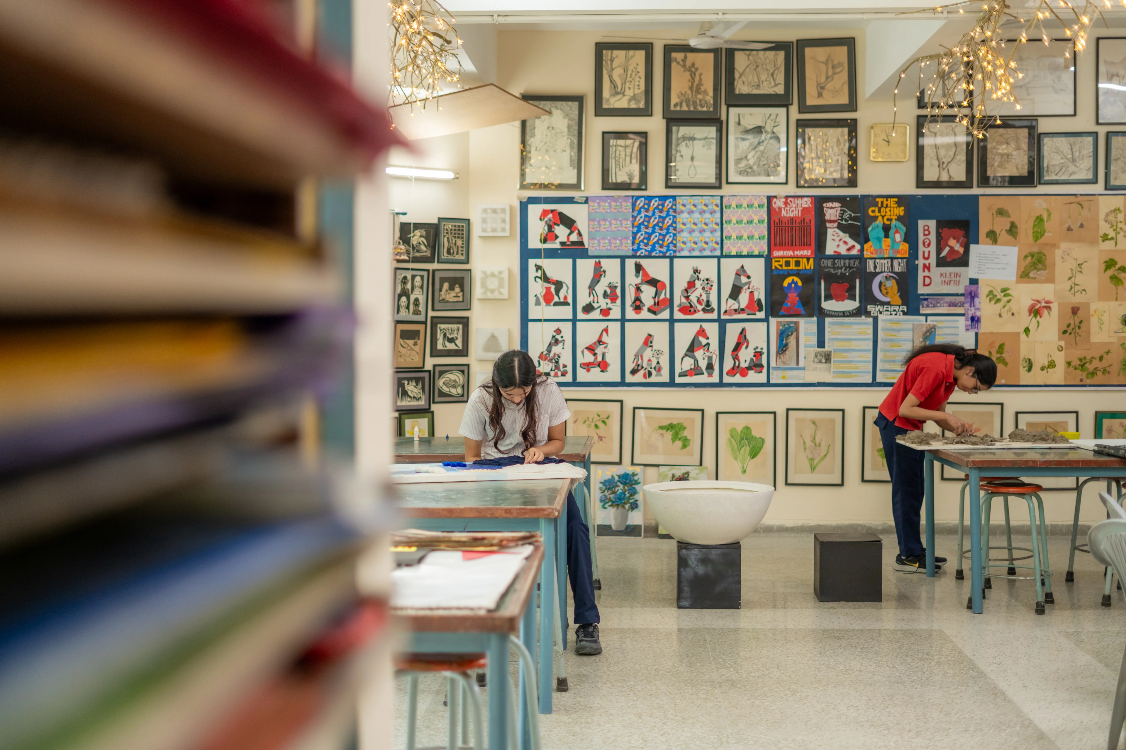 A student holding a paint palette in an art class at The Shri Ram School